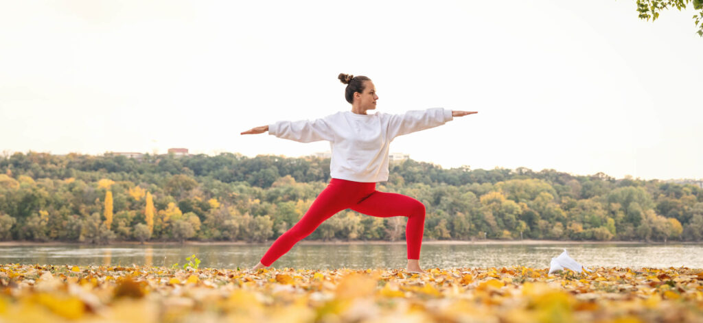 Woman exercising outdoors, doing recovery workouts for better overall health