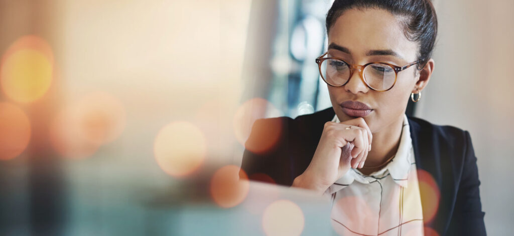 Woman reviewing documents on her computer