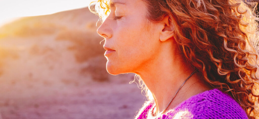 Woman finding peace and calm when stressed, learning how to deal with the emotional impact of a MASH diagnosis