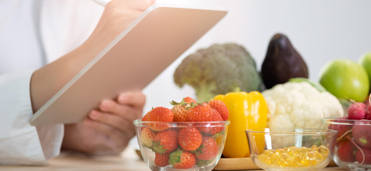 Doctor taking note of different diet options, CKD healthy lifestyle changes