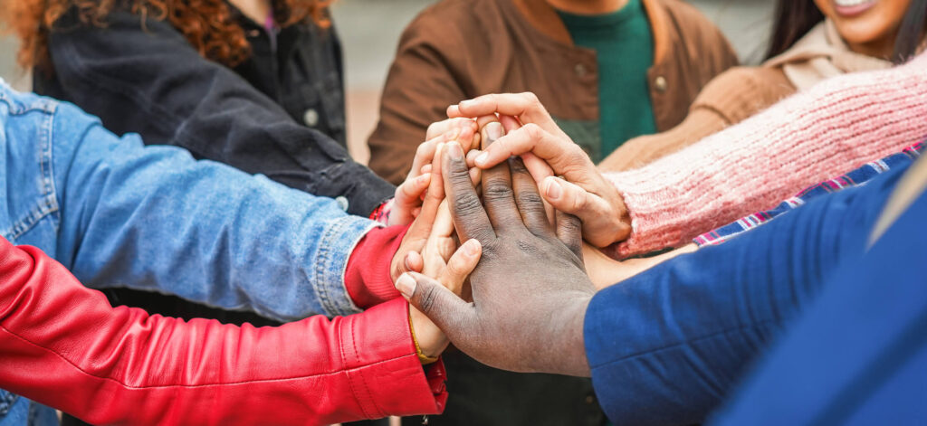 Group of friends holding hands, supporting each other