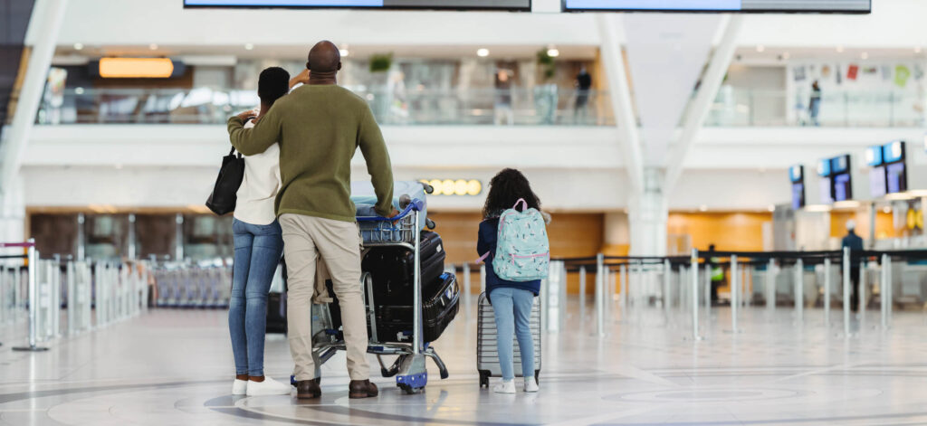 Family at the airport, getting ready to travel. Flying with chronic kidney disease