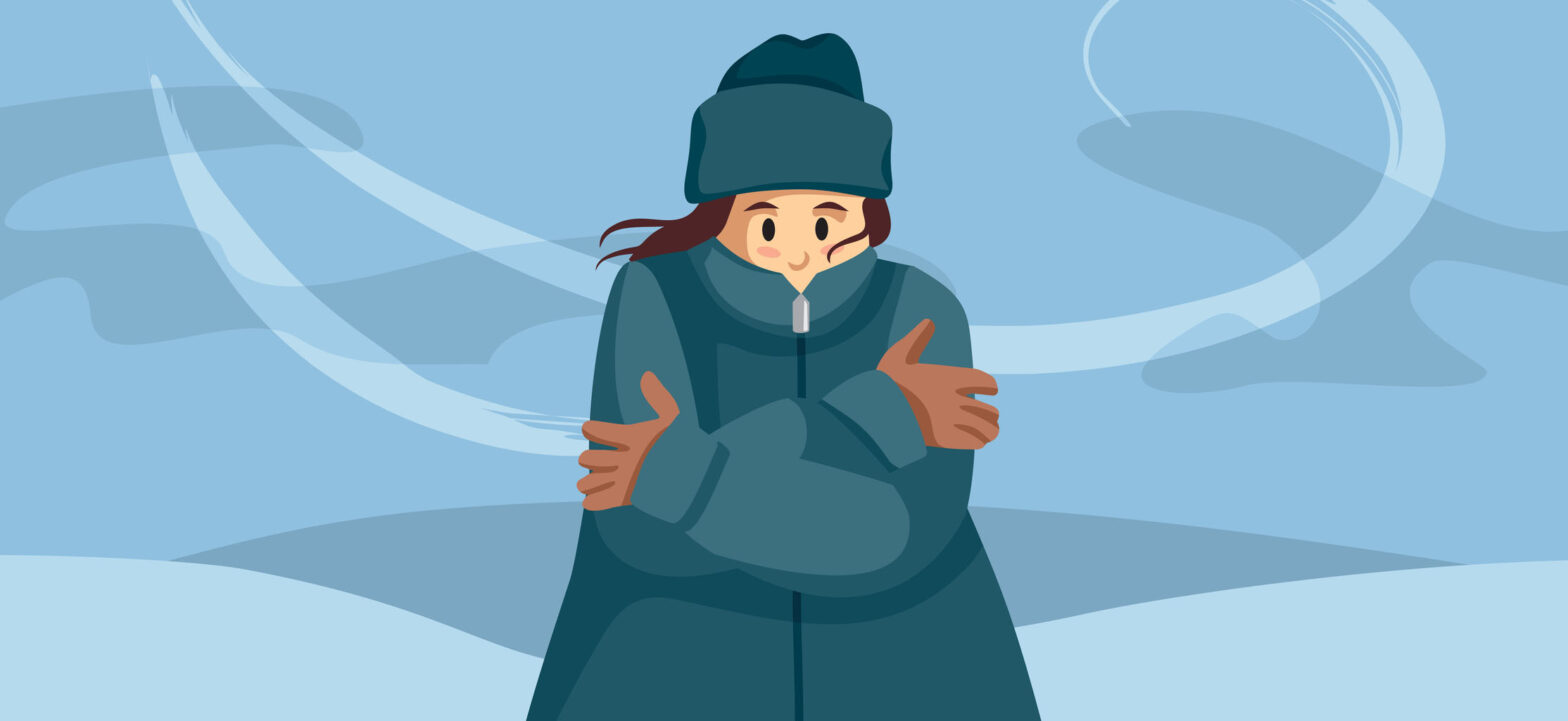 Shivering person feeling cold during seasonal snowstorm