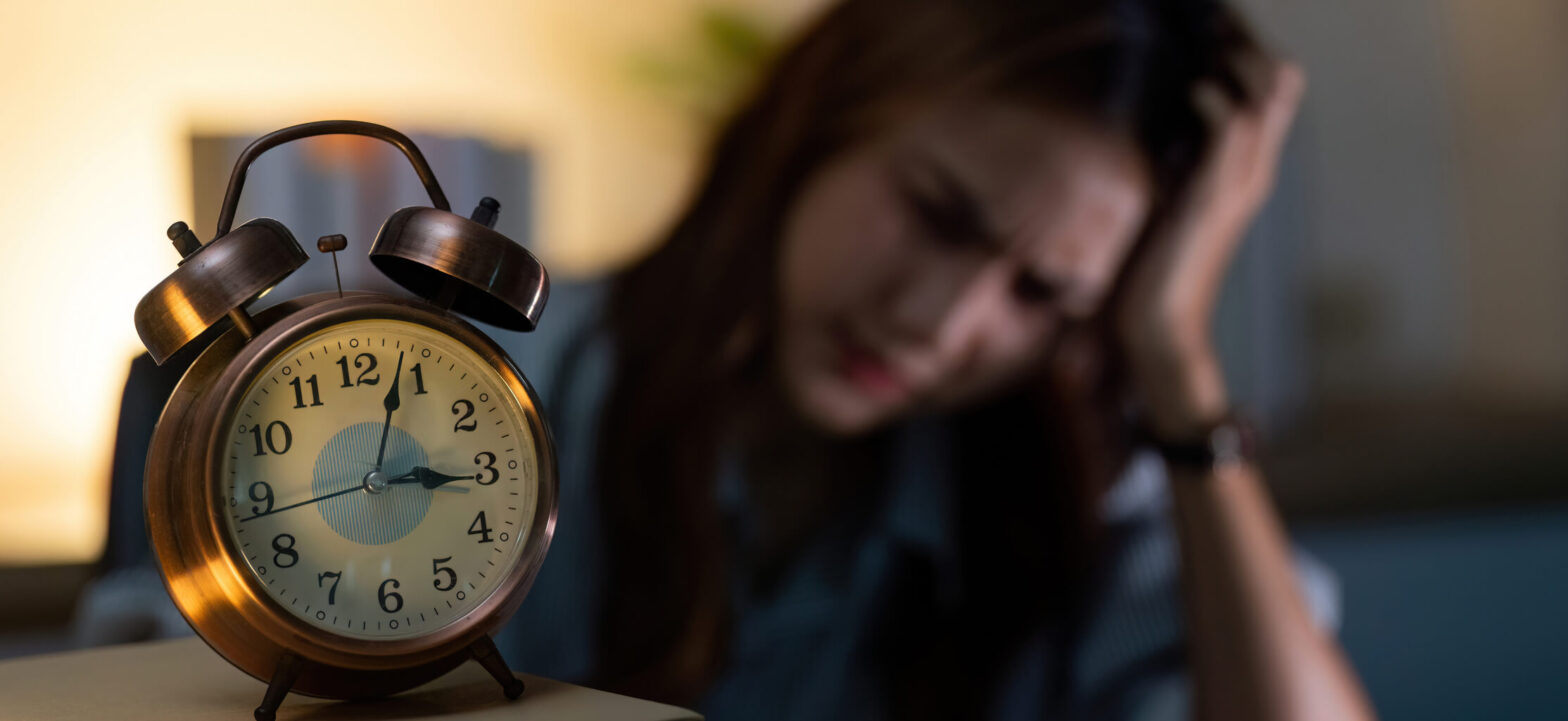 Woman tired with a clock, energy banking