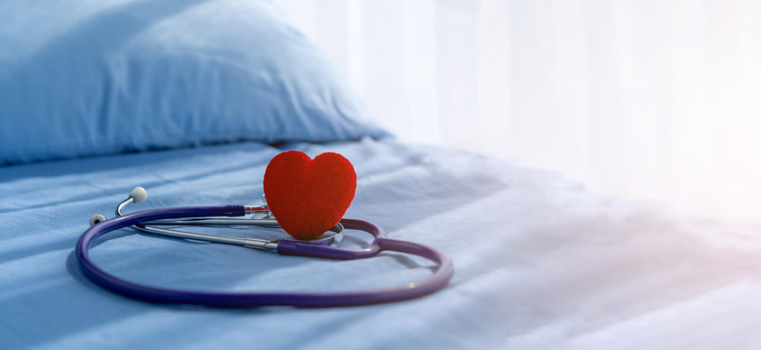 Heart and a stethoscope lying on a bed, sleep and cardiometabolic health