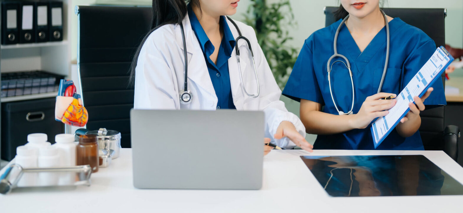 Two physicians looking at test results in a lab